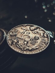 coins on a black background