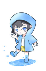 水たまりで遊ぶレインコートを着た女の子