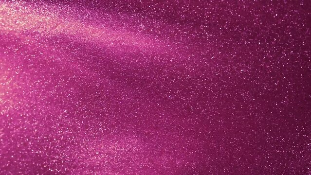 Floating dust particles in magenta fluid. Sparkling glitter particles floating in liquid. Abstract glistering powder background. - Powered by Adobe