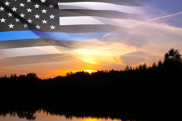 Thin Blue Line. American flag with police blue line on a background of sunset. Support of police and law enforcement. National Law Enforcement Appreciation Day - obrazy, fototapety, plakaty