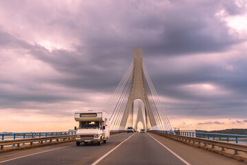 Fototapeta na wymiar Motorhome driving over the Portimao bridge in the Algarve, Portugal.