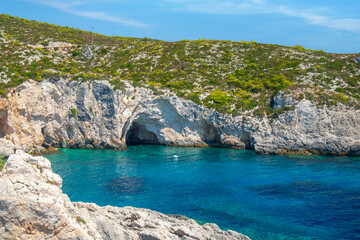 Rocky Porto Limnionas beach on Zakynthos island, caves in the bay, beautiful crystal clear color Ionian sea - 623364683
