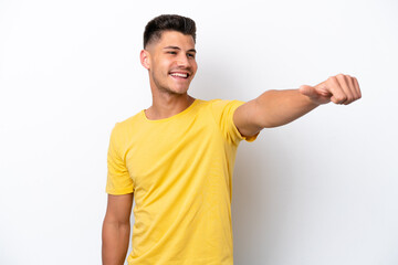 Young caucasian man isolated on white background giving a thumbs up gesture