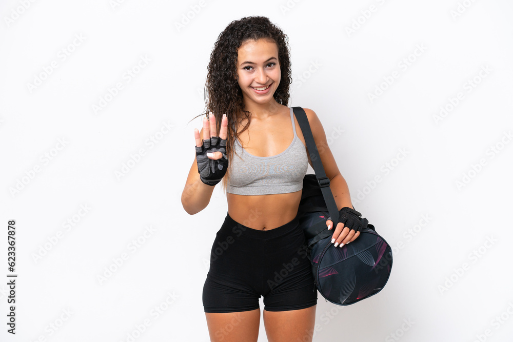 Wall mural Young sport Arab woman with sport bag isolated on white background happy and counting four with fingers