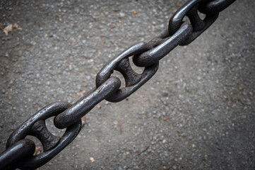 Detail closeup texture of a very thick metallic chain