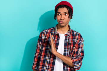 Photo of dissatisfied guy with dreadlocks wear plaid shirt hold palm show stop decline gesture...