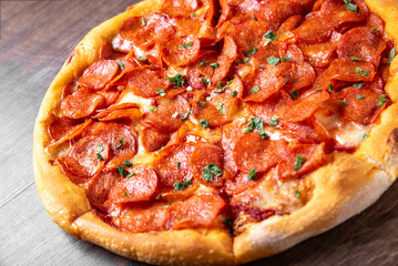 Pepperoni Pizza with Mozzarella cheese, salami, Tomato sauce, pepper, Spices. Italian pizza on...