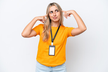 Young caucasian woman with ID card isolated on white background having doubts and thinking