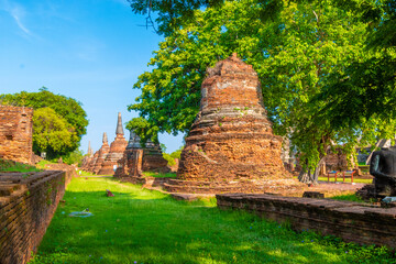 The ruins of the Wat Phra Si Sanphet temple in Ayutthaya Historical Park, a UNESCO world heritage site, Thailand - obrazy, fototapety, plakaty
