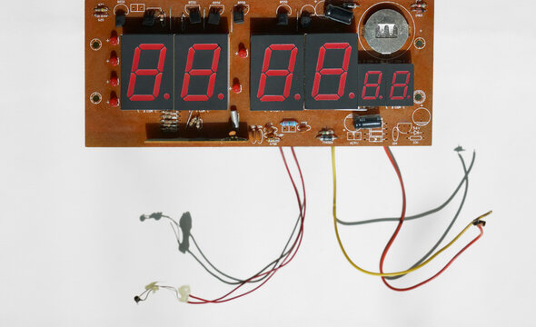 bomb detonator countdown to explosion. Dynamite bomb with digital timer countdown. Zero at the end. Terrorism. Disassembled old digital display mechanism, macro photo.