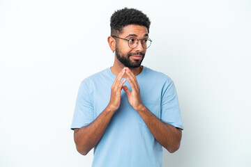 Young Brazilian man isolated on white background scheming something