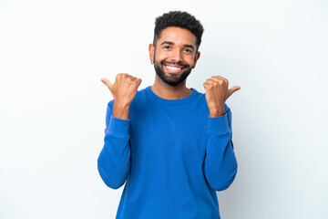 Fototapeta premium Young Brazilian man isolated on white background with thumbs up gesture and smiling