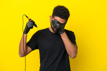 Tattoo artist man Brazilian man isolated on yellow background with tired and sick expression