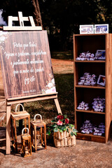 a board written "so that all may see and know, consider and understand together that the hand of the Lord has done this" next to a shelf with well-weds and picture frames