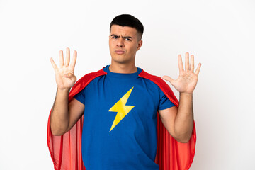 Super Hero over isolated white background counting nine with fingers