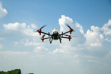 Agriculture drone fly to sprayed fertilizer on the fields. Industrial agriculture and smart farming