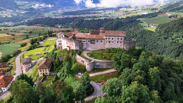 medieval castles of northern Italy.  Castle Stenico and village. Trentino region, province of Trento. Aerial drone high angle view
