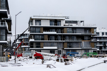 snow-covered construction site during the construction of residential buildings