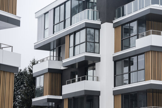 condominium penthouse living area with wooden balcony and stunning view of winter forest