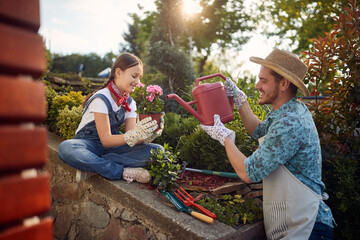 Gardening Teamwork: Father and Daughter Nurturing Blooms Together