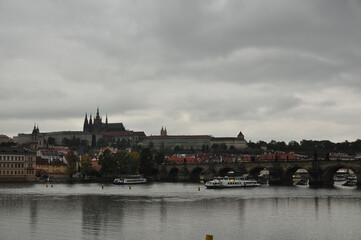 Fototapeta na wymiar View of the Vltava River and Charles Bridge in the rain. Prague, Czech Republic