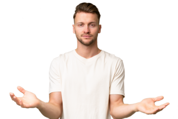 Young blonde caucasian man over isolated background having doubts