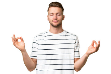 Young blonde caucasian man over isolated background in zen pose