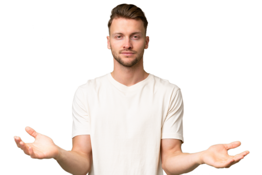 Young blonde caucasian man over isolated background having doubts