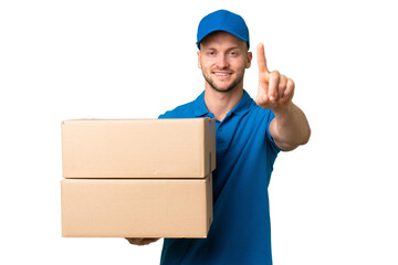 Delivery caucasian man over isolated background showing and lifting a finger