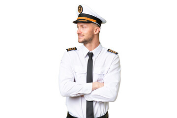 Airplane pilot man over isolated background looking side