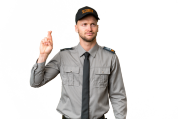 Young security caucasian man over isolated background with fingers crossing and wishing the best