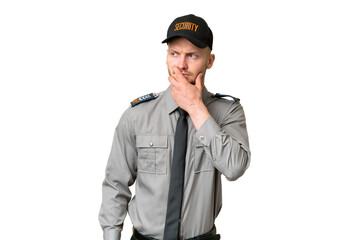 Young security caucasian man over isolated background having doubts and with confuse face expression
