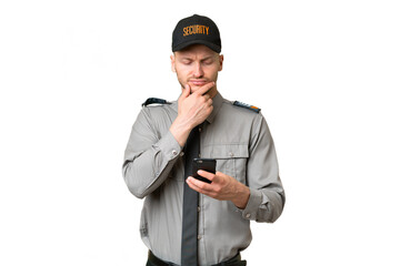 Young security caucasian man over isolated background thinking and sending a message
