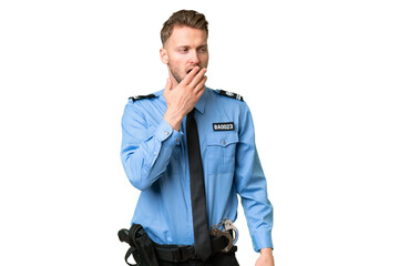 Young police man over isolated background yawning and covering wide open mouth with hand