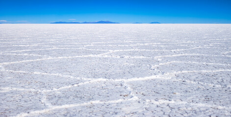 Scenery view of wild nature salt flat with mountains, scenic backgrounds. Panoramic landscape photo...