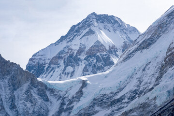 View of majestic snow covered himalayan range from everest base camp trek in nepal. Few of them are world's highest mountains. Glaciers and icy himalaya and ice wall seen at summit.