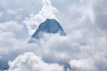 Cloud covered Ama Dablam is one of the most beautiful mountains in the world standing at an elevation of 6,812 metres (22,349 ft).Mother's necklace mountain peak seen at Ama Dablam base camp in Nepal.