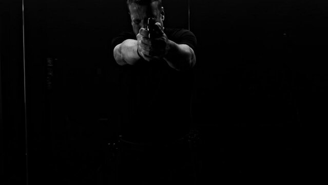 Man Training Dynamic Shooting with Handgun (IPSC) in Switzerland.