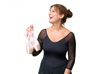 Middle-aged caucasian woman practicing ballet over isolated background laughing in lateral position