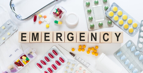 Wooden blocks with EMERGENCY text of medical concept.