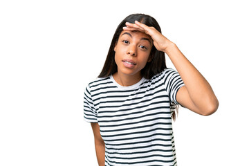 Young African american woman over isolated background looking far away with hand to look something