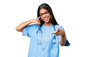 Young African american nurse woman over isolated background making phone gesture and pointing front