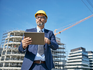 businessman construction site business architect building engineer builder tablet helmet architecture blueprint worker man contractor adult engineering industry