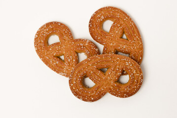 Three shaped rye cookies with crystal sugar isolated on white background top view