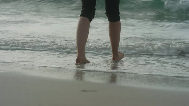 Pretty Blonde Girl Walking Barefoot into the water at the Beach, Bleik, Lofoten Islands, Norway, Beautiful Sunset Atmosphere