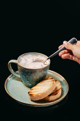 Cappuccino ?ream-soup on a black background