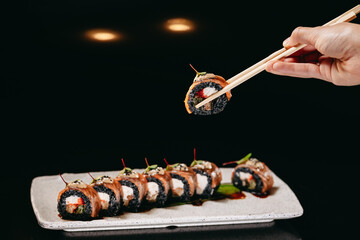 Tuna Dragon roll in chinese chopsticks
