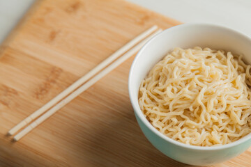 Ramen noodles in a bowl and chopsticks. Ramen concept. Noodle concept.