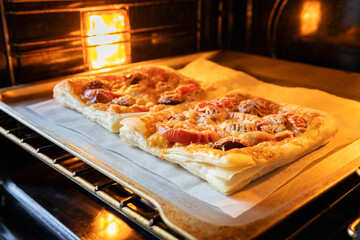 Closeup of hot fresh baked pizza. Preparing pizza pieces at home