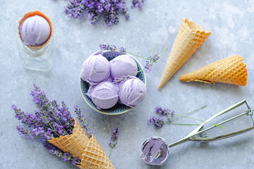 Creamy balls vegan lavender ice cream in plate with flowers french lavender. flat lay, top view.
